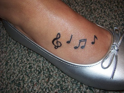 Voice music notes tattoos on