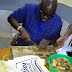 Photos: Gov. Fayose photographed cutting kpomo and meat