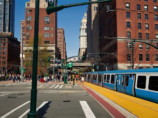 A vibrant depiction of Boston's public transportation scene - colorful subway lines, bustling transfers, serene ferry rides, and off-peak calmness. Experience the ease of city exploration in a dynamic visual