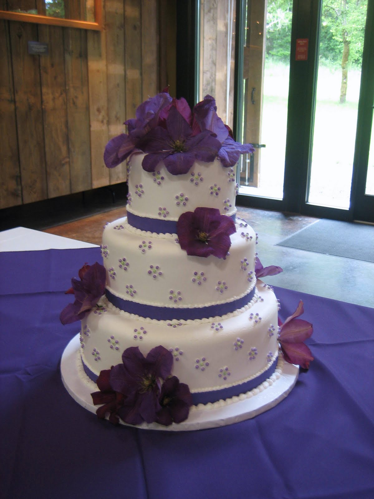 wedding cake designs with flowers The accent color to the royal purple was lime green and since it was 