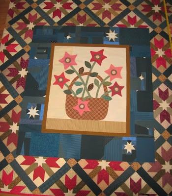 Gwennie Inspired medallion center on top of pieced blocks