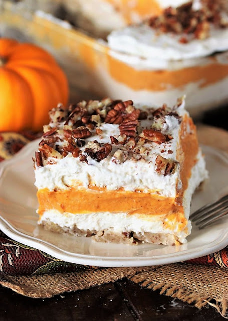make layered dessert has creamy pumpkin deliciousness sandwiched between two layers of flu Pumpkin Yum Yum Dessert