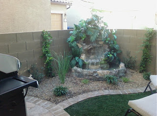 concrete block wall, barbecue grill, recliner and a water-fall in the corner