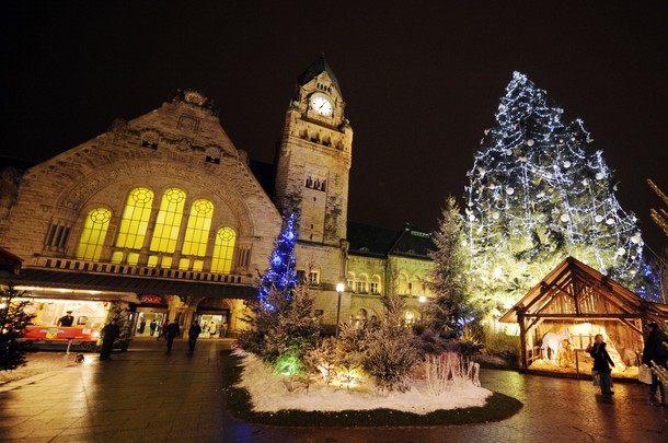 french railway station wallpaper. Visitors walk through the christmas market down the railway station on the 