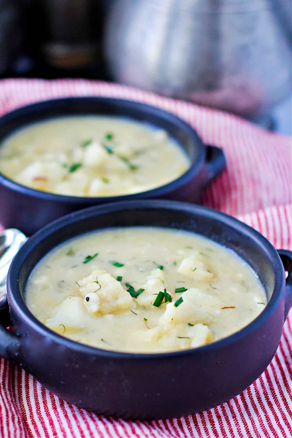 Scandinavian-Style Fish and Potato Soup in two bowls.