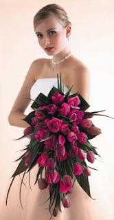 bride holding bunch of flowers