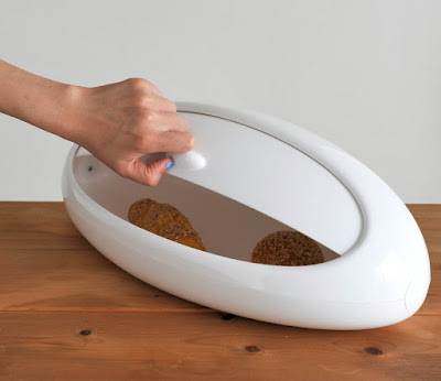 white bread bin, oval shaped, sort of a futuristic look