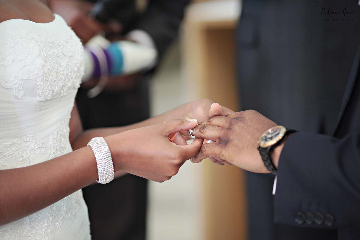 exchange of rings during ceremony at St John's Hyde Park wedding
