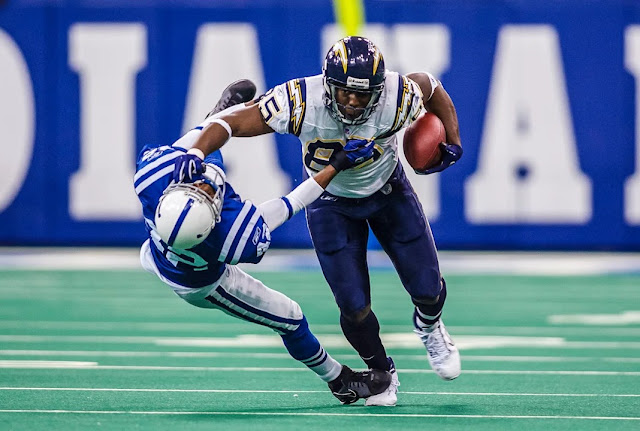 San Diego Chargers TE Antonio Gates stiff arming an Indianapolis Colts player.