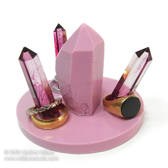 Pink faux crystal resin ring holder with 3 burgundy and clear hexagonal crystals to hold rings