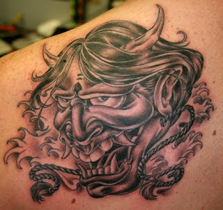 Best Skull Tattoo Design on Upper Back Man 