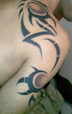 Tribal Tattoos Design on The Arm and Back