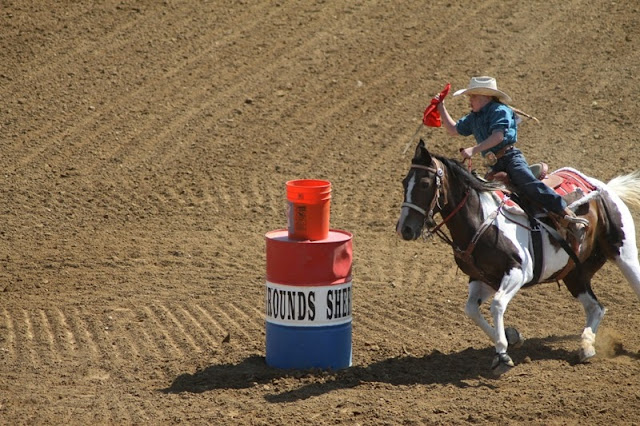 a contestant navigates the second bucket of the flag race