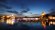 Downtown Disney is attractive at night with lights, islands and bridges.