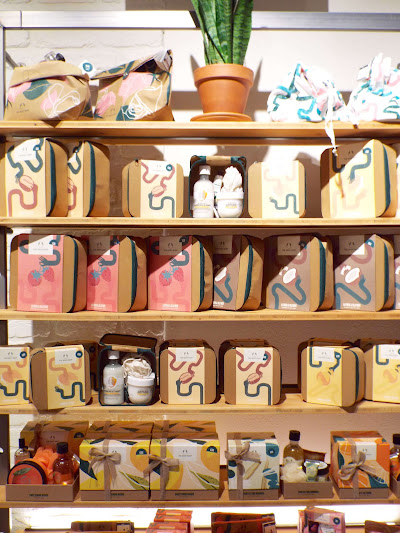 Shelf with array of plastic-free, sustainable beauty gift sets.