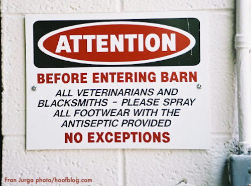 barn sign warning of biosecurity precautions