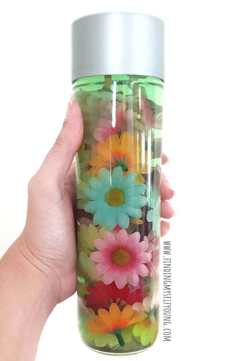 Flower sensory bottle using fake flowers and water.