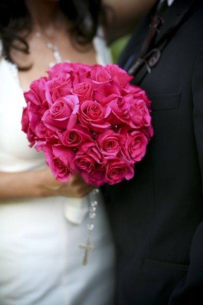 Bright Pink Rose bridal bouquet The pink roses stems are wrapped in white 