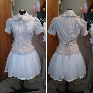 A front and back view of the pintuck blouse. It is a very faint pink colour. The crocheted lace make it look like it could be good for old school lolita, but the colour is more suited to classic lolita.