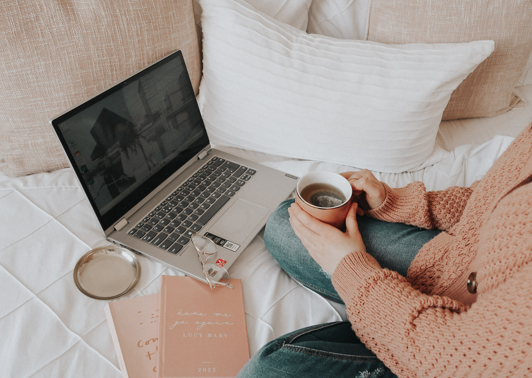 A laptop and a cup of green tea.