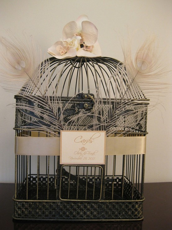 You can buy vintage looking bird cages from stores like Pottery Barn and 