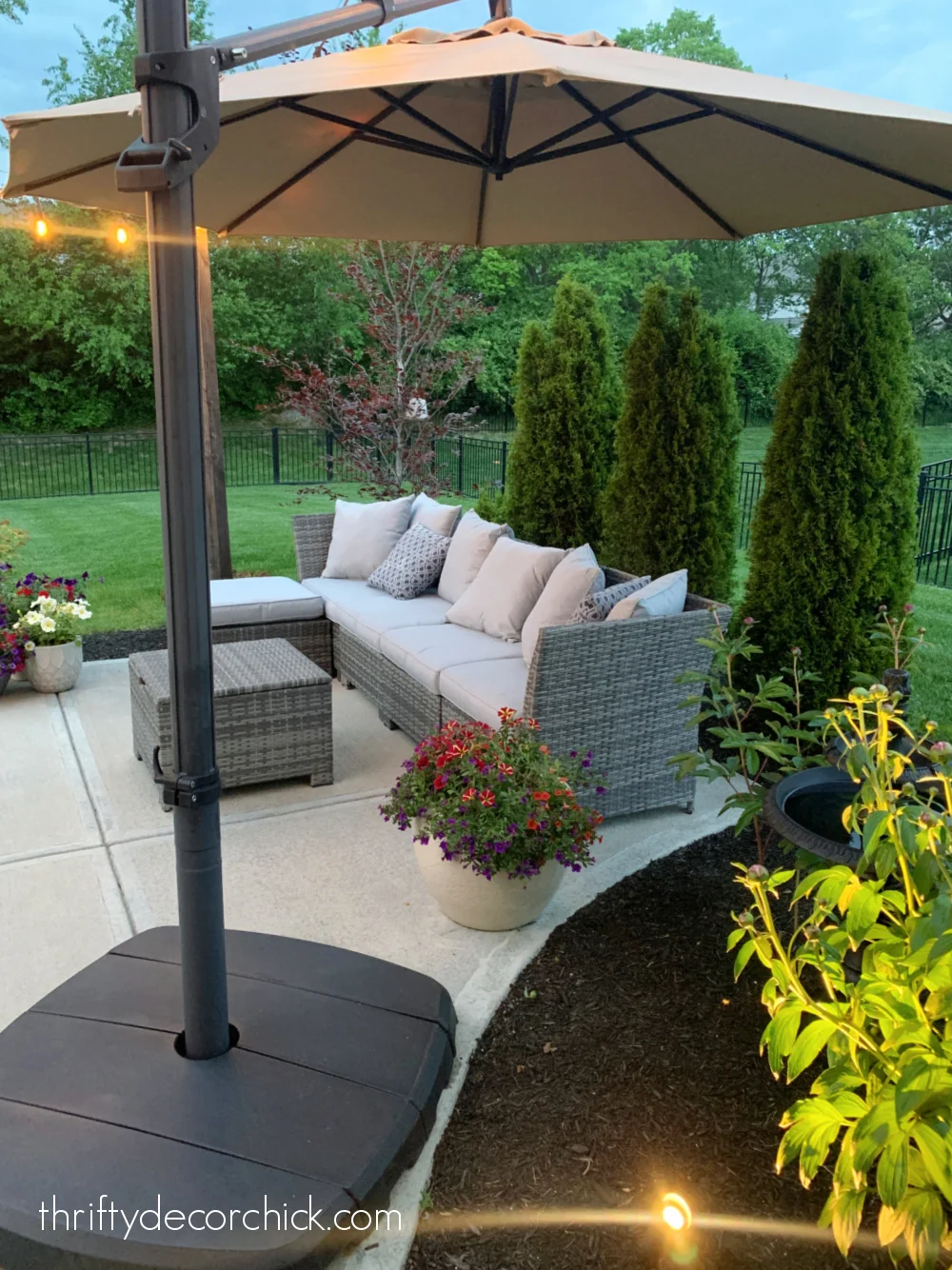 large umbrella over outdoor sofa