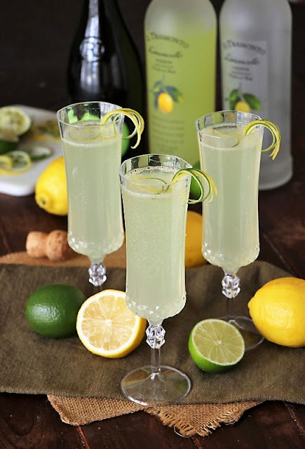 Sparkling Limoncello Coolers in Champagne Flutes Image