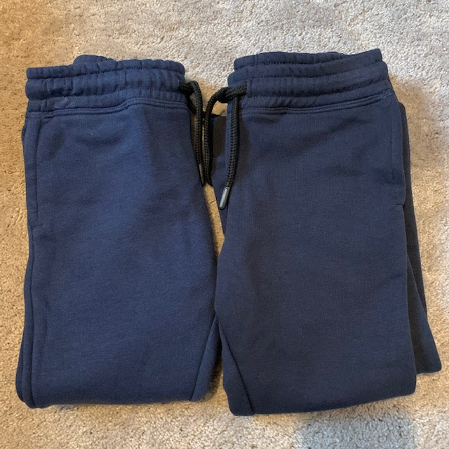 Two pairs of blue jogging bottoms