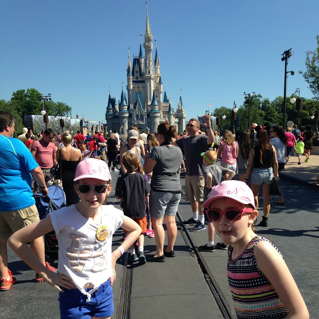 stephstwogirls in front of Disney castle