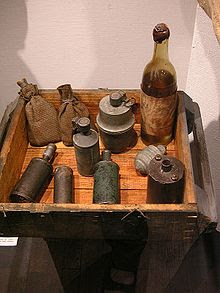 A display of improvised munitions, including a Molotov cocktail, from the Warsaw Uprising, 1944.