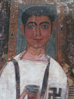 Egyptian funerary shroud showing a man with a large swastika on his shirt.