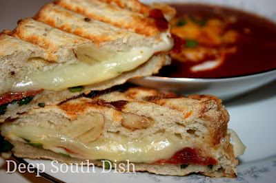 Layers of mozzarella and provolone cheese, pepperoni, and a bit of marinara sauce and fresh basil are tucked into an artisan bread and grilled. Shown here with my fresh homemade tomato soup for a classic supper.