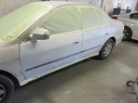Honda being masked for paint at Almost Everything Auto Body