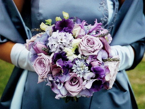 This Purple Rose Hand Tied contain purple roses white and purple tulips 