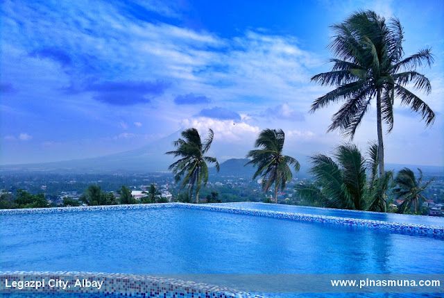 The Oriental Legazpi hotel's infinity pool with a view of Mayon and Lignon Hill