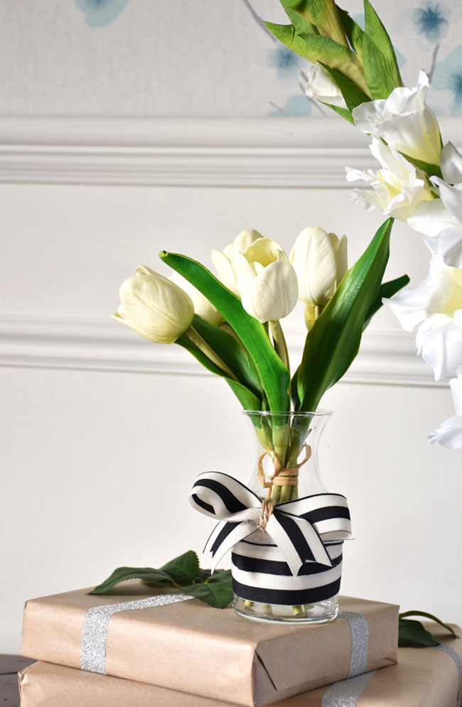 Quick diy vase decoration using ribbon in your color scheme for Christmas.