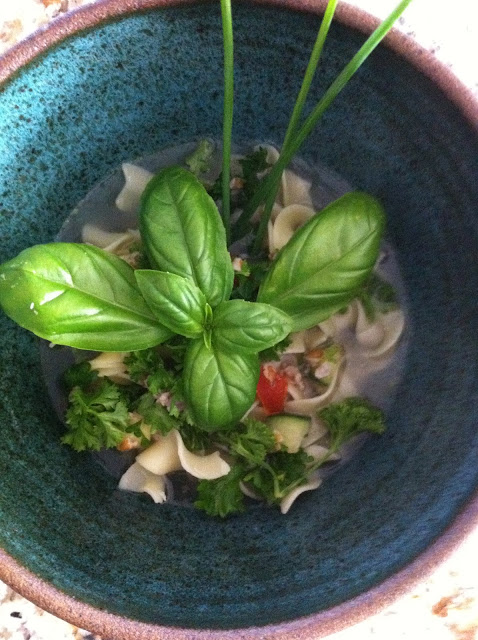 chicken bone broth with tabbouleh and garden fresh herbs soup