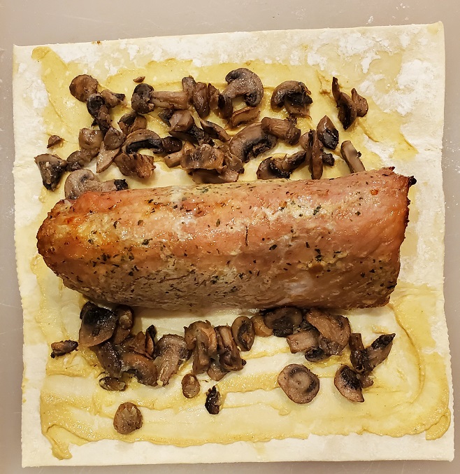 pork tenderloin cooked on puff pastry with mushrooms