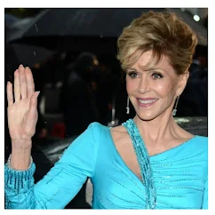 Jane Fonda waves her right hand