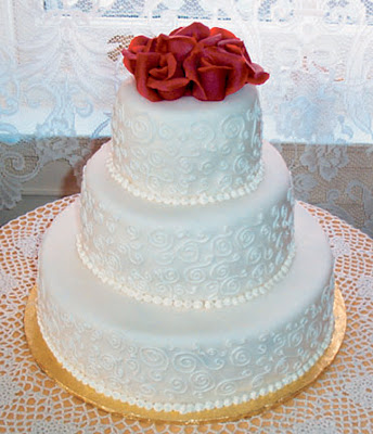 white wedding cake with rose