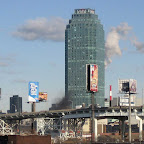 Citicorp Queens - White power plant exhaust and clouds behind, black smoke and the LIE below; from the Greenpoint Ave. bridge.