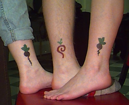 Three ankle tattoos pictured together.