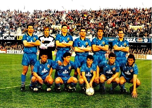 VALENCIA C. F. Temporada 1990-91. Giner, Ochotorena, Penev, Roberto, Tomás y Fernando; Toni, Quique Flores, Eloy, Camarasa y Arias. C. D. CASTELLÓN 0 VALENCIA C. F. 2. Domingo, 10/02/1991. Campeonato de Liga de 1ª División, jornada 22. Castellón de la Plana, estadio de Castalia. Árbitro: Juan Andújar Oliver. Entrenadores: Castellón: Luiche; Valencia: Víctor Espárrago. Goles: 0-1: 52’, Quique Flores. 0-2: 62’, Fernando.