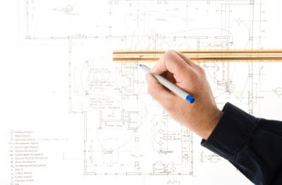 Architect reviewing a blueprint