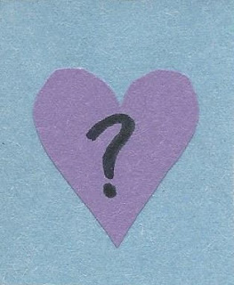 Paper purple heart with a question mark on a blue background