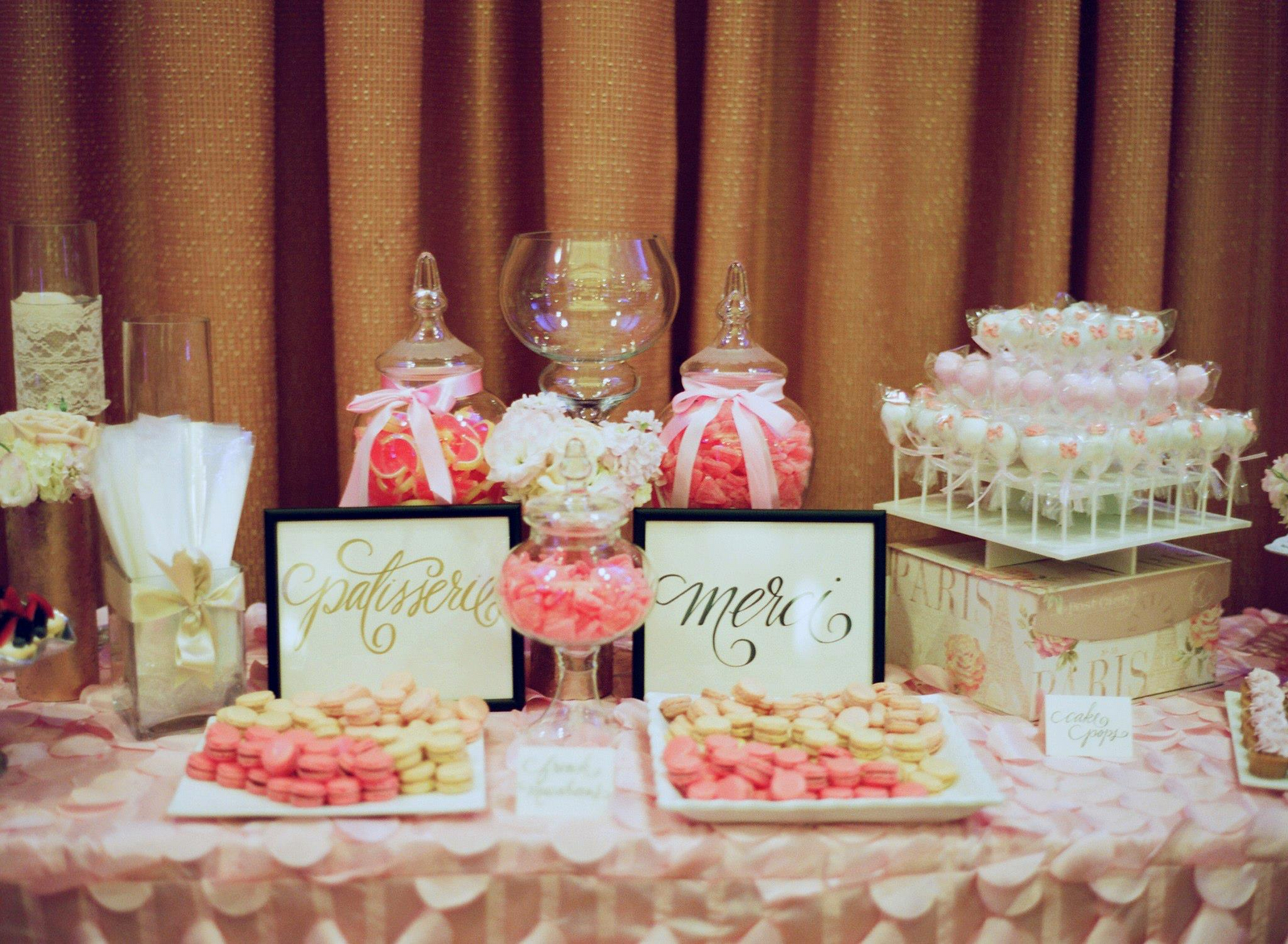 pink and gold wedding cake made three macaron flavors, pink with chocolate ganache, light pink 