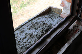 Cement goes in for the new windowsills