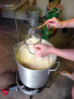 Audrey scooping foam to prevent a boil-over.