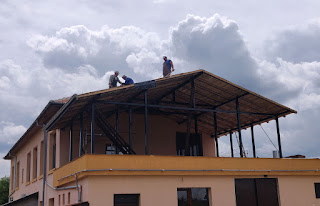 Men work as the storm builds