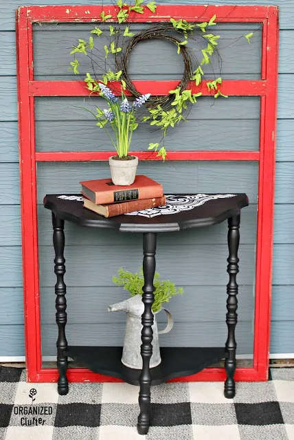 Photo of demilune table in black with stencils